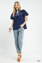 Navy blue Umgee textured puff sleeve blouse with white piping and puffed short sleeves for stylish wear