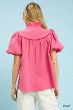 Umgee vibrant pink textured puff sleeve blouse with puffed short sleeves and ruffled collar features elegant design