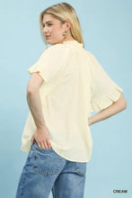 Cream-colored Umgee textured ruffle sleeve blouse with gathered neckline and lightweight fabric for elegant wear