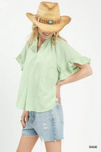 Light green Umgee blouse featuring a subtle textured ruffle sleeve design with a delicate woven texture
