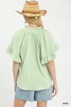 Light sage green umgee textured ruffle sleeve blouse with smocked neckline and ruffled sleeves