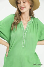Apple green umgee textured split neck puff sleeve top with v neckline and delicate white beaded trim along placket