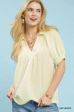Off-white umgee textured trim short sleeve blouse with relaxed fit and gathered neckline for casual wear