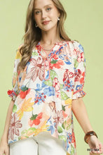 Umgee watercolor floral print blouse with puff sleeves ruffled hem and colorful blossoms on light cream fabric