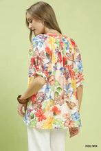 Umgee watercolor floral print top in red mix featuring colorful blossoms and butterflies on a light background