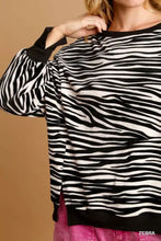 Black and white umgee zebra striped fleece pullover sweater shirt with ribbed cuffs and hem for casual wear