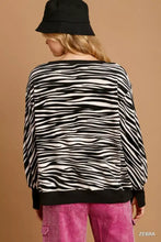 Umgee zebra striped fleece pullover sweater shirt with black and white zebra stripes and black ribbed cuffs and hem