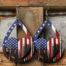 Pair of US flag pattern wooden earrings with heart cutouts