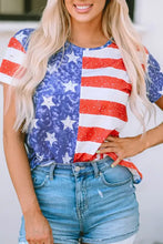 Woman in US flag round neck short sleeve t-shirt and denim shorts
