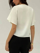 White satin v-neck button-down shirt with flowing blouse design and short fluttery sleeves in lightweight fabric