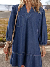 Women’s medium-wash long sleeve denim dress with v neck collar single chest pocket and tiered hem