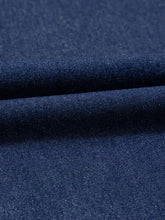 Dark blue textured woven denim fabric of a v neck collared long sleeve denim dress with single chest pocket