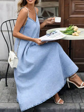 Light blue denim cami dress with v-neckline and thin straps perfect for casual summer wear