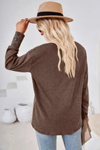 Brown long-sleeve V-neck dropped shoulder knit top with button cuffs