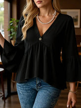 Black v-neck flounce sleeve blouse with gathered waist featuring stylish neck flounce sleeves for elegant wear
