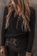 Black V-neck half button long sleeve henley shirt with silver buttons