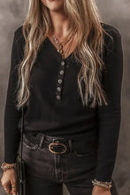 Black V-neck half button long sleeve henley shirt with silver buttons