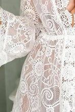 Sheer white V-neck lace cover-up dress with intricate floral patterns