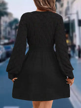 Back view of V-Neck Long Sleeve Sweater Dress with black knit diamond-patterned design