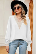 White long sleeve V-neck blouse with embroidered trim