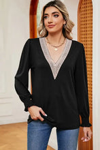 Black V-neck long sleeve blouse with white lace trim