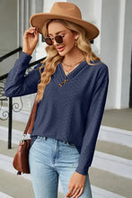 Navy blue V-neck long sleeve t-shirt with textured pattern and buttons