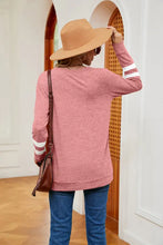 Women’s long sleeve pink sweatshirt with white arm stripes, moderate stretch