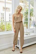 Beige spaghetti strap sleeveless jumpsuit with v-neckline and elastic waistband