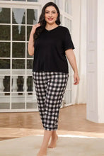 Black and white checkered plaid cropped pants with small red hearts in v neck tee and sleeve length lounge set