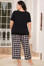 Black and white gingham plaid cropped pants with small red heart accents in v neck tee lounge set with sleeve length details