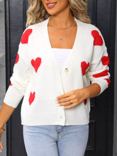 White slightly stretchy knit cardigan with Valentine’s day heart pattern