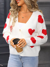 White slightly stretchy knit cardigan with Valentine’s day heart pattern