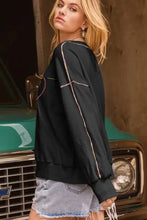 Valentine’s Day rhinestone heart black long-sleeve sweatshirt with denim shorts