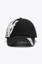 Vibra Graphic Distressed Adjustable Baseball Cap with paint splatter