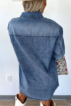 Blue denim dress with vintage wash featuring a relaxed fit button-down design and short sleeves