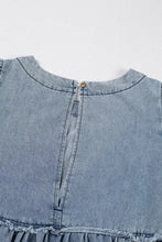 Light blue vintage wash denim dress with round neckline frayed hem and pockets for casual wear