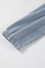 Light blue vintage wash denim dress sleeve with elasticated cuff showcasing soft denim material and casual style