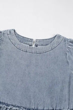 Light blue vintage wash denim dress with round neckline frayed hem and pockets in soft denim fabric