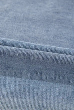 Light blue vintage wash denim dress with subtle textured weave and pockets made from soft denim fabric