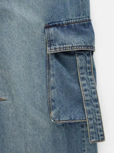Blue denim vintage wash wide leg cargo jeans pocket with reinforced stitching and matching fabric flap