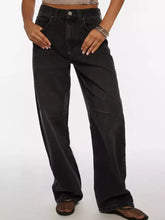 Black wide leg denim jeans with vintage wash and subtle fading details showcasing a relaxed straight-cut silhouette