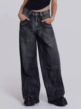 Dark gray wide leg denim jeans with vintage wash and multiple large patch pockets in a wide leg style