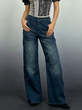 Dark blue denim vintage wash wide leg jeans with geometric patchwork detailing and a wide leg cut