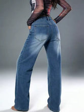 Blue denim wide leg jeans with vintage wash and faded finish featuring a relaxed wide leg cut