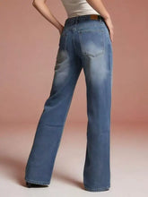Blue denim vintage wash wide leg jeans showing faded wash and classic back pockets from the back side