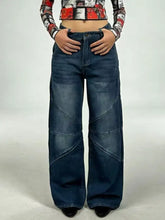 Dark blue denim vintage wash wide leg jeans with patchwork design and diagonal seams for a stylish look