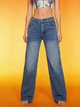 High-waisted blue denim vintage wash wide leg jeans with a faded look and wide leg cut for a relaxed fit
