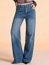 Mid-wash blue vintage wash wide leg jeans with classic five-pocket design and button closure in denim material