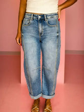 Light-wash denim shift jeans with vintage washed seam detail and relaxed wide-leg cut with rolled cuffs