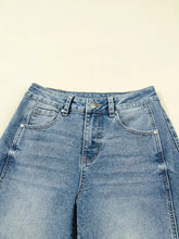Vintage washed seam shift jeans in high waisted faded blue denim with classic stitching details